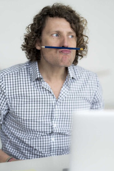 businessman-balancing-pencil-on-his-face.jpg